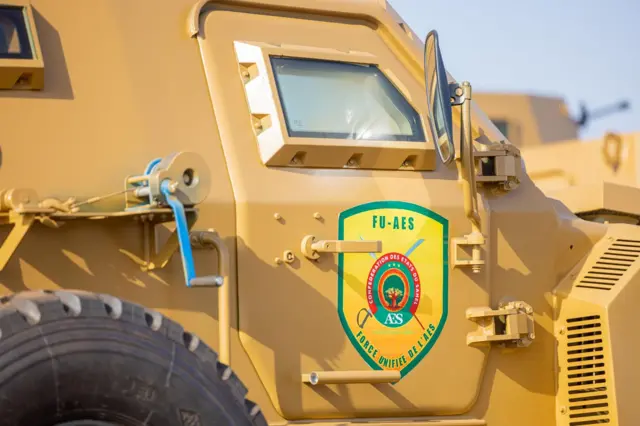Military vehicle displaying AES unified force insignia