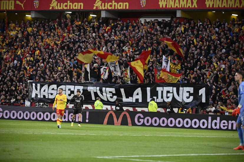 Supporters of RC Lens display a protest banner during the Ligue 1 match against Paris Saint-Germain