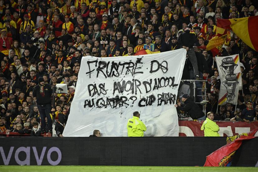 Lens supporters display their response banner during the match