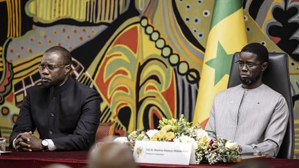 Prime Minister Ousmane Sonko (left) and President Bassirou Diomaye Faye (right) at a ceremony at the presidential palace in Dakar on October 16, 2025