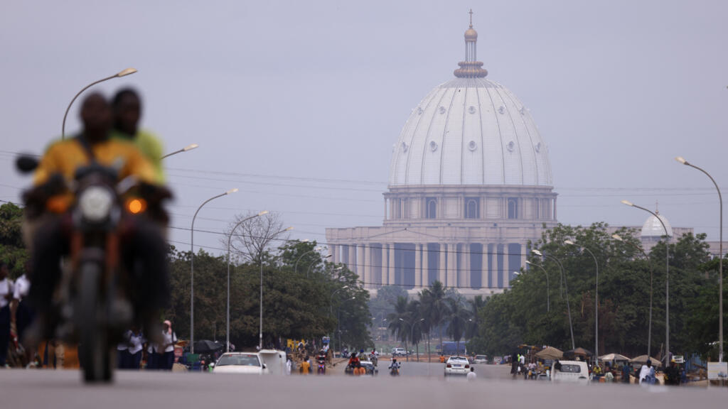 Aerial view of Yamoussoukro’s Notre Dame de la Paix basilica, showcasing the city’s expanding urban landscape