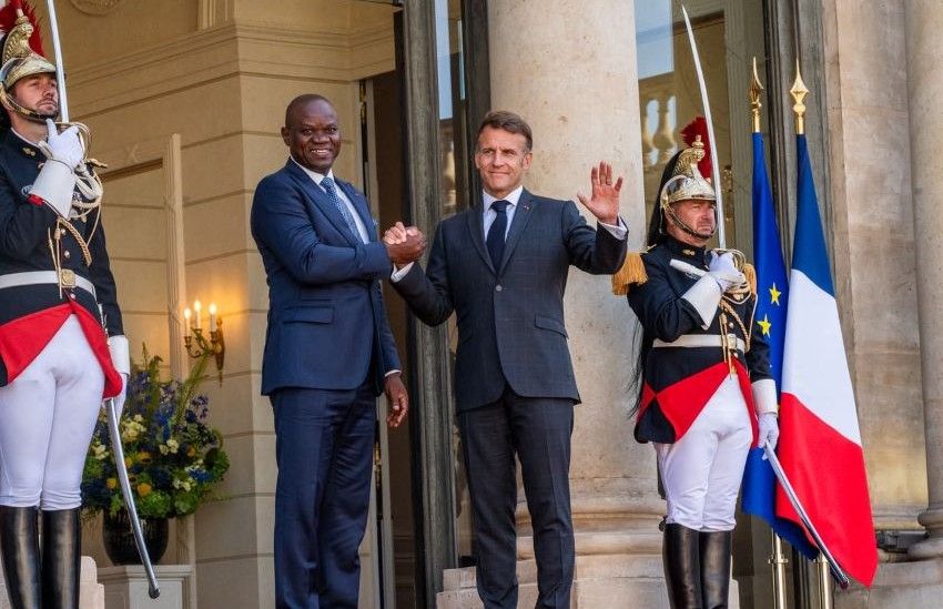 Presidents Macron and Oligui Nguema standing side by side at the Élysée Palace