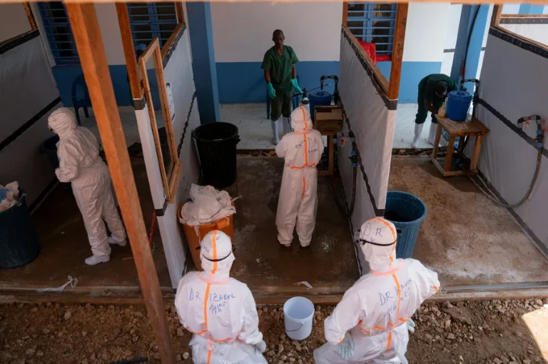 Health workers in protective gear during an Ebola response drill